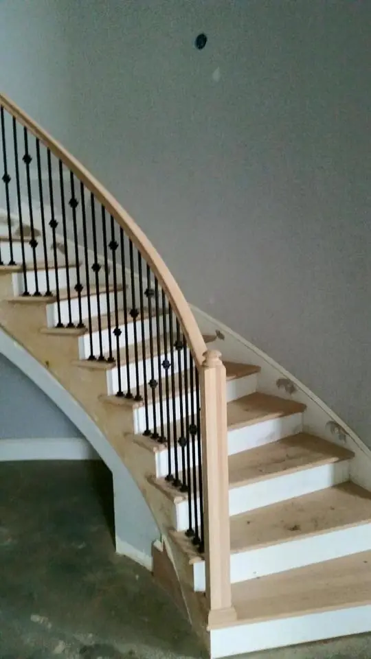 The finished curved stair with its oak handrail set