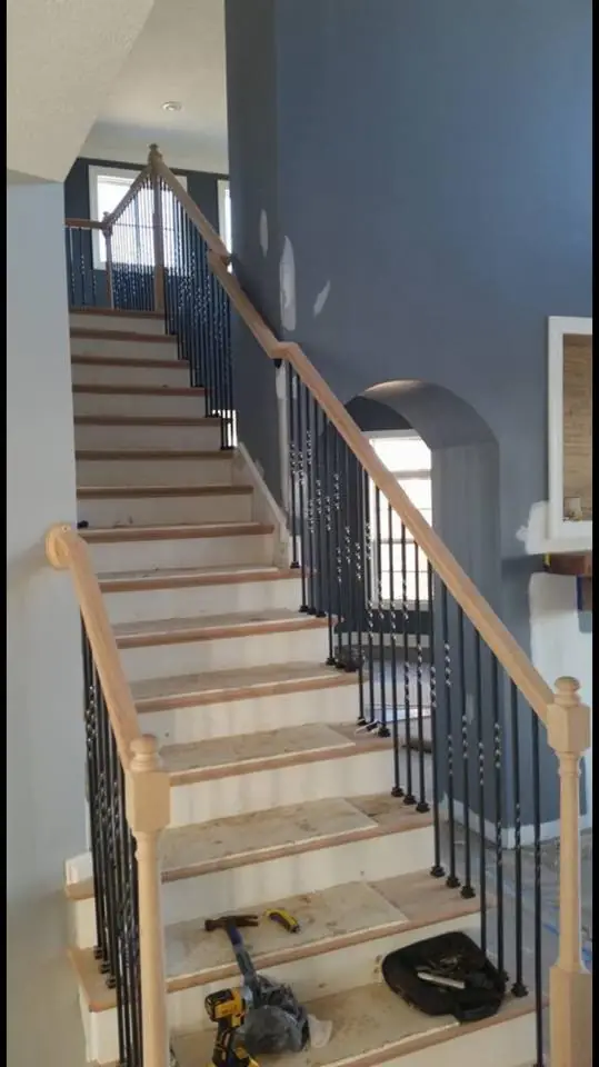 The same foyer staircase, looking up from the floor below